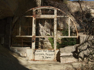 Goreme:  Gate to a farm yard with a warning that there is a dog.