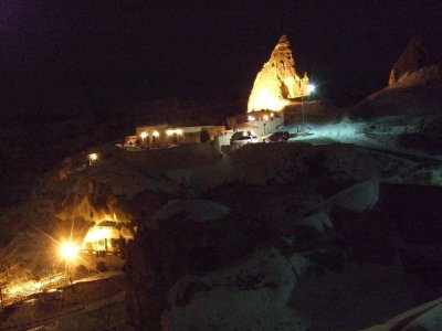 Goreme: A view of our hotel at night--Its between the bright lights below, and the fairy chimney in the top of the photo