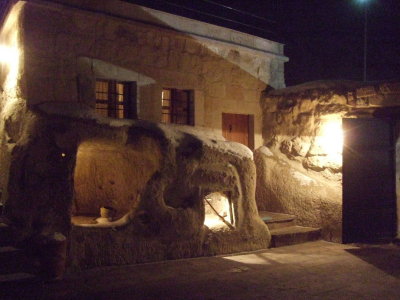 Goreme: The courtyard entrace of Travellers Cave Hotel at night, in the snow.