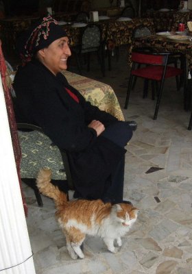 Goreme: Something you won't see in the USA--the restaurant cat (with her owner).