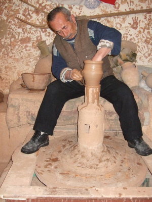 There is a large pottery shop at the foot of the Cavusin Church where you can watch, or even try to make a pot.