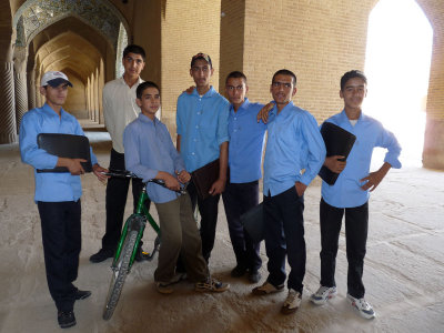 a group of students; the guy leaning on the bike said he is fourteen