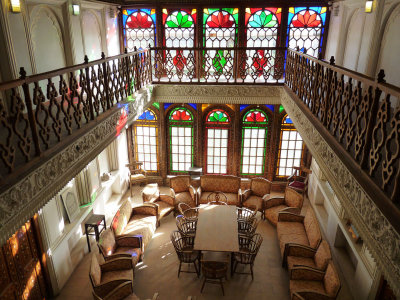 the rooms have a breathtaking combination of intricate tiles, inlaid wooden panels, and beautiful stained glass windows