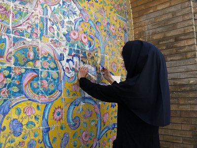 a free lance artist working on restoring the artwork