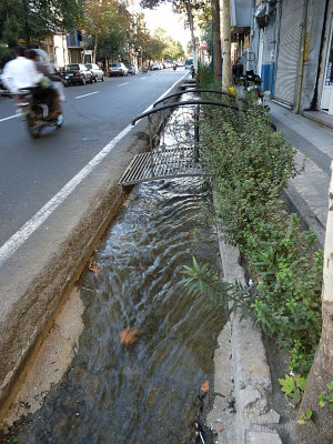 the city has water ways along the path to clear the rubbish and to cool down the city