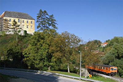 Train passing Ozalj Castle