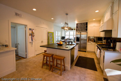 Standing in DR and looking towards kitchen and bkfast rm. We added a 3rd door to pantry where the quilt is hanging.