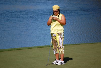 Christina takes notes on the 2nd green