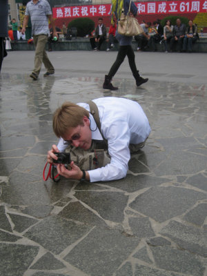 Chris was either lining up a shot or photographing tiny Mao statues