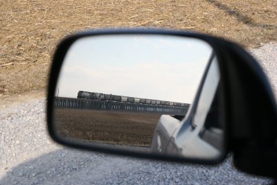A northbound grain train sneaks up from behind