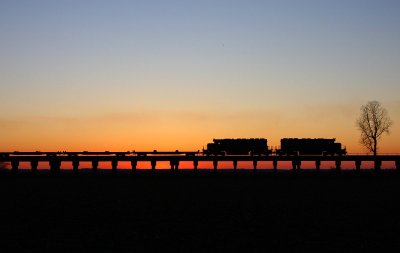 W876 moves north in front of a nice sunset at Rahm.