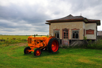 Orange Tractor and House