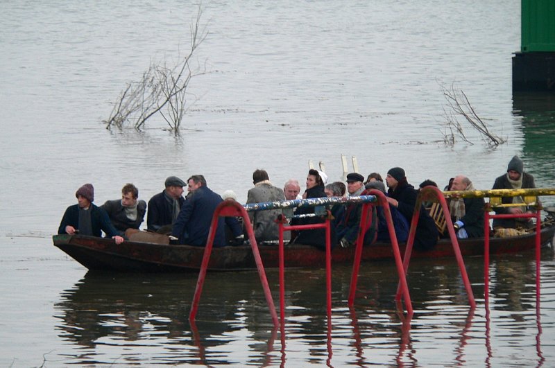 Victims arriving at the pension.Red swings rise above water.