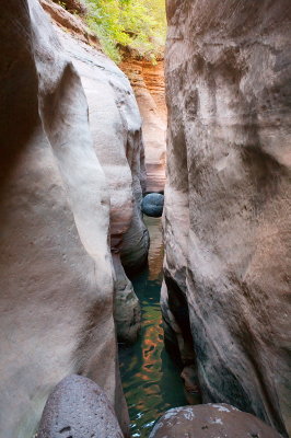 Squeeze under the chockstone...