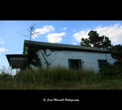 Old Abandoned Building with Clouds in Sky