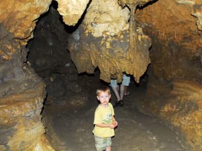 Brooks walks under a stalactite