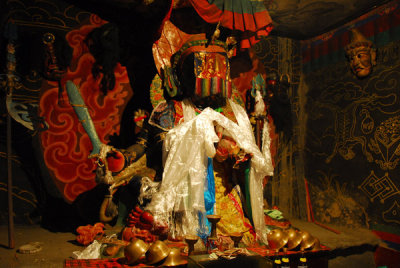 Black seated statue of Gnpo, Gnkhang chapel