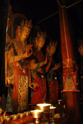 Bodhisattvas in the Tsangkhang illuminated by butter lamps