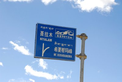 Sign for Mt Shishapangma (Mt. Xixiabangma) and the road through the Kyirong Valley, 5263