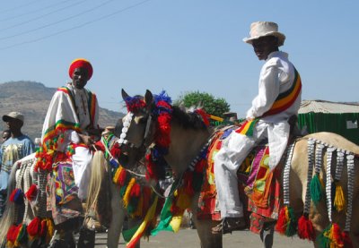 A pair of riders dressed colorfully for Timkat