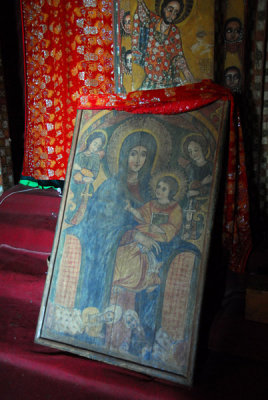 The priest uncovered the painting for us