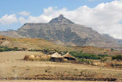 Village of thatched huts with the mountain of Ashetan Maryam