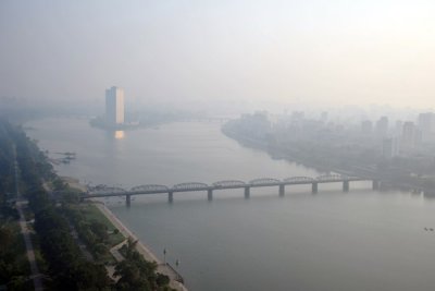 View south along the Taedong River to the Yanggakdo Hotel, Pyongyang