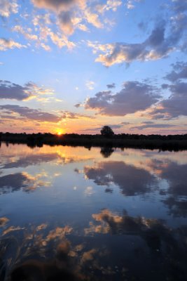Sunset with clouds reflecting in the Kafue River