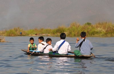 Five boys paddling home from school, Inle Lake
