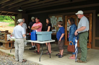 Back towards camera: Steve Finke explains the workings of a bee hive