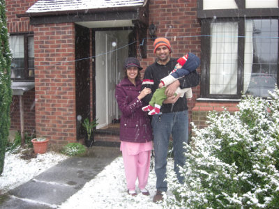 Happy Young Family in Fresh Snow