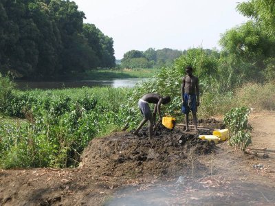 Farming the banks of the Nile, with burning trash in the foreground