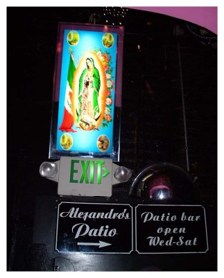 Virgen de Guadalupe light next to the exit signs.