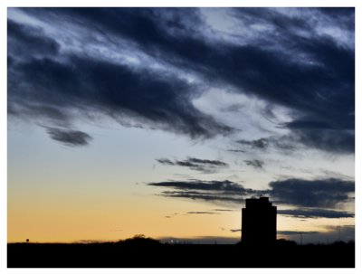 Grain Elevator Silhouette at Sunset