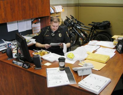 Deputy Chief Perry Lambert manning his office
