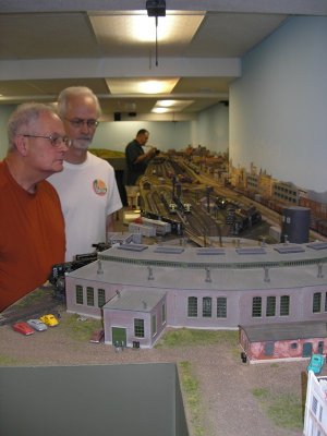 Bud and Paul inspecting Raton on Bob Foltz's layout