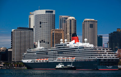 Queen Victoria cruiseliner with Sydney CBD backdrop