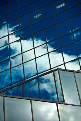 Windows with cloud reflection