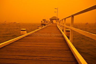 Palm Beach wharf in dust storm