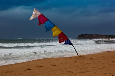 Bali flag in storm at Collaroy Beach