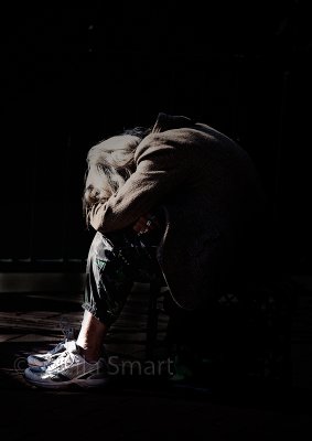 Lady at Quay with head down