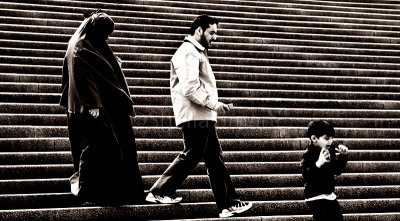 Muslim family on steps of Sydney Opera House in mono