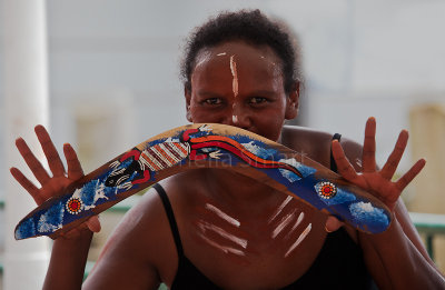 Female aboriginal dancer with boomerang