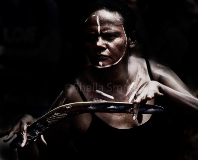 Aboriginal female dancer with boomerang