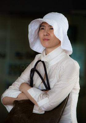 Asian lady holding handbag