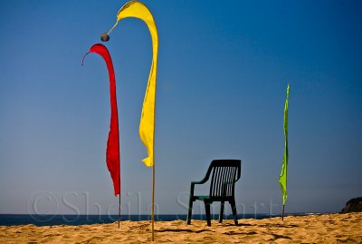 Bali flags and chair on beach