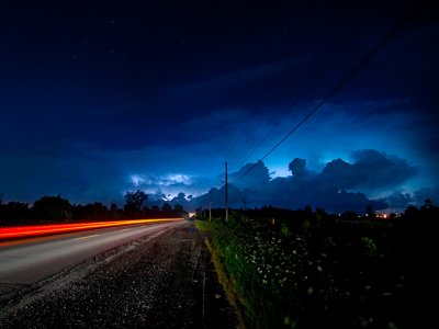 Lightning behind clouds