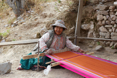 a lady on the path making material