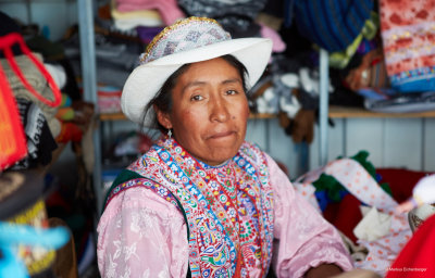 a lady making traditional dresses