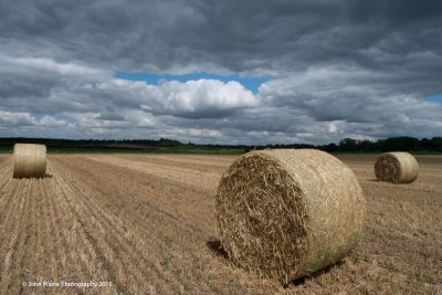 Round Bales, Stormy Sky